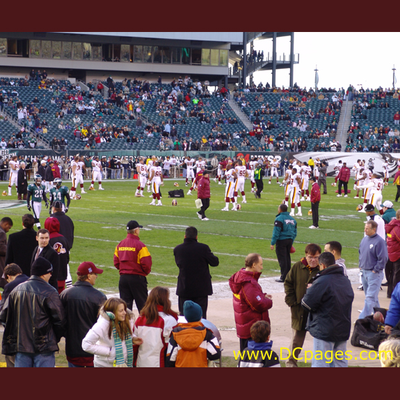 Redskins and Eagles stretch out before playing.
