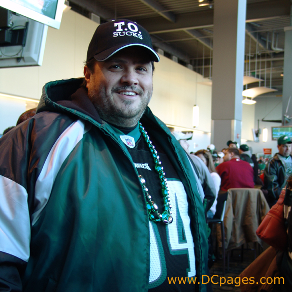 Defensive tacle material. Love the T.O. SUCKS hat and the silver and green football party beads.