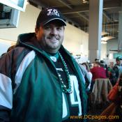 Defensive tacle material. Love the T.O. SUCKS hat and the silver and green football party beads.