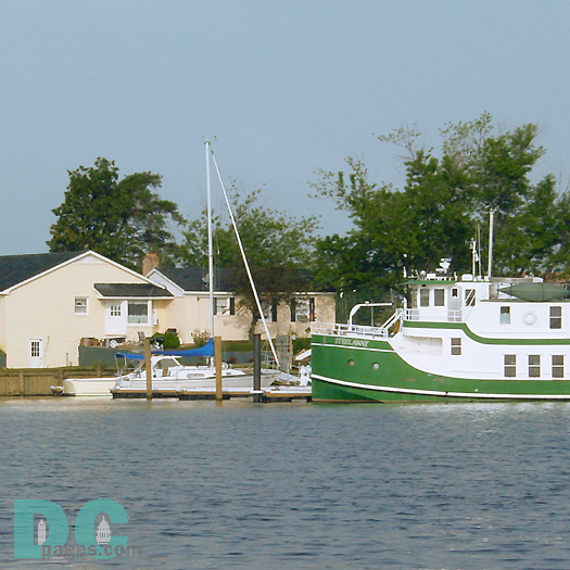 A tugboat waits ready to help boats that need assistance getting into the marina.