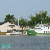 A tugboat waits ready to help boats that need assistance getting into the marina.