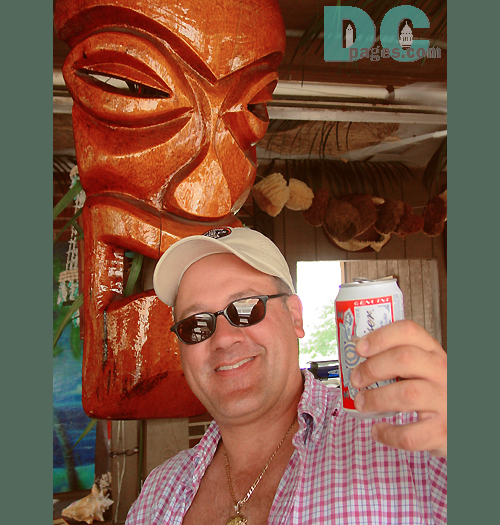 A bust of Ayumma Yumma (the god of tasty rockfish), smiles down on Chris as he toasts his special day to the King of Beers. 