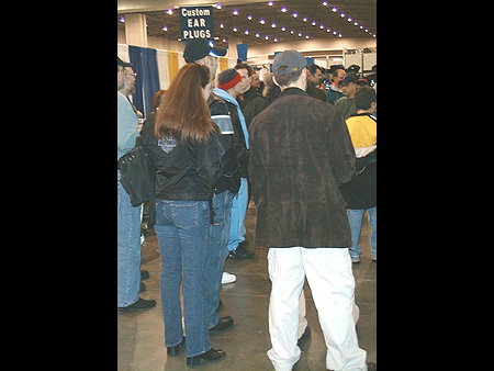 The crowd gathers to watch a motorcycle extreme stunt video.