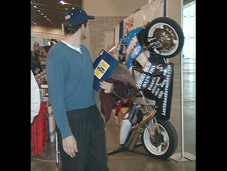 If you look closely at the bike, you can see a roll cage going around it's fairing.
