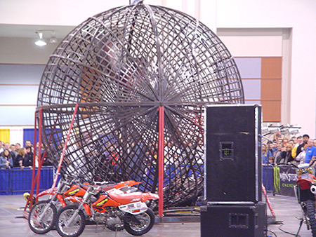 The one of a kind performance features three motorcycle riders hitting some serious G-forces as they synchronize their motorcycles to perform insane stunts in a giant 16-ft steel globe.