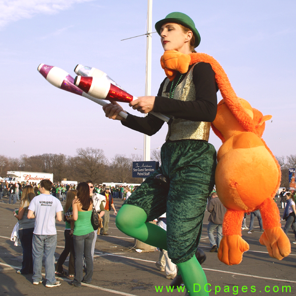 The juggler takes the monkey hostage.