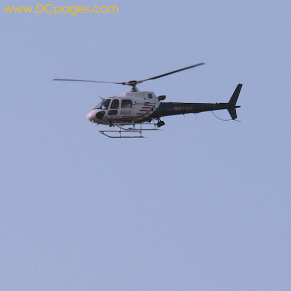 DC Police watch the crowd from above in thier spiffy helicopter.