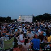 As darkness comes the crowd gathers.