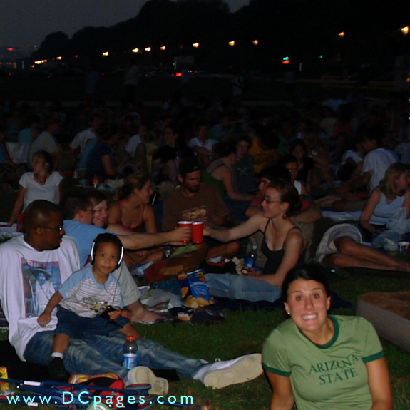 A group toasts the beginning of the movie.
