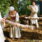 Fresh chickens were skewered onto a 6 foot pole.