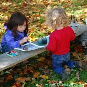 These two children fun painting 18th century prints with water colors.