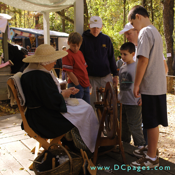 Sally Jenkins gathers a crowd around her spinning wheel.