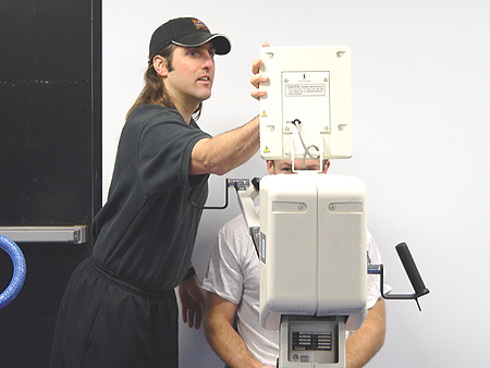 Capitals strength coach, Jim Fox, programming Michael Nylander's upper body drill.