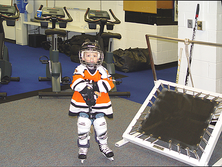 John Gruden's son stops by on his way out to the ice.
