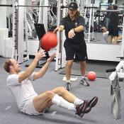This may look easy, but the ball actually weights ten pounds.