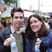 Jessica and James enjoy a refreshing drink of water from the Drink More Water stand.