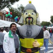 Michael Glickman, of Rockville, Maryland, spends time with the Mongolian Barbeque mascot before testing out the food.