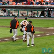 Baltimore Orioles catcher Ramon Hernandez gets some final advice from his teammates.
