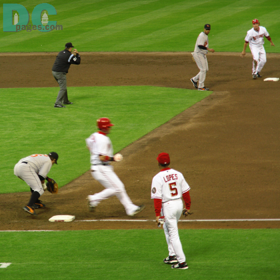 The umpire signals out and the Nationals end the inning by hitting into a double play.