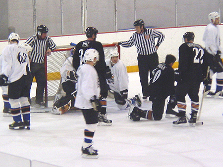 A little commotion in front of the net.