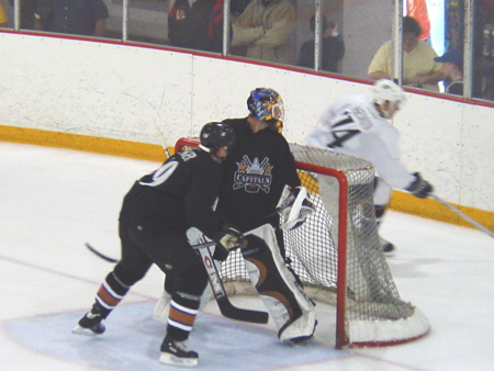 Kolzig checks out what's going on behind him.