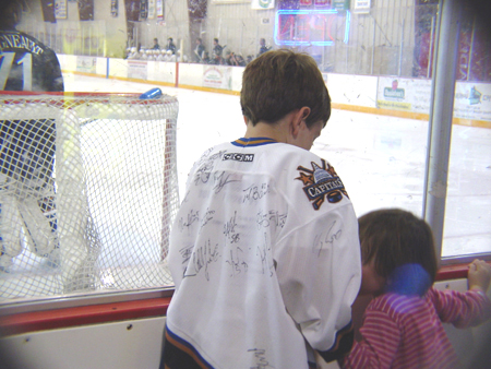 This CAPS fan showing his sister all of his autographs.
