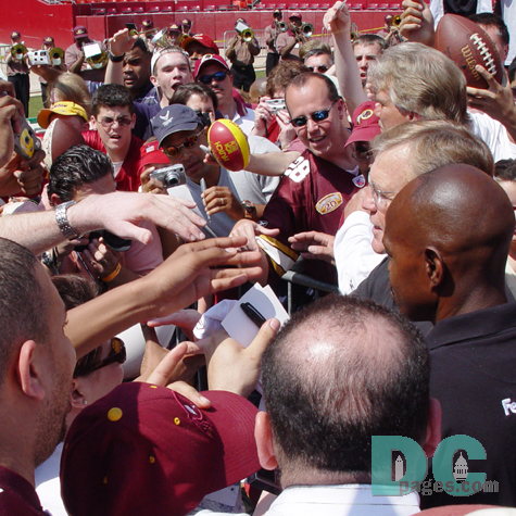 Redskin fans crown around Washington's most beloved football coach.