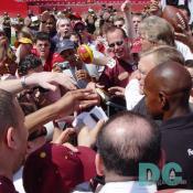 Redskin fans crown around Washington's most beloved football coach.