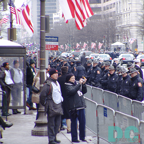 attendees watching Presidential motorcade