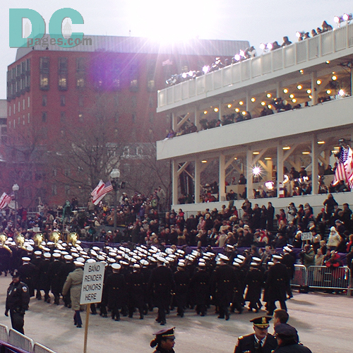 Marching performers pass Presidential Review Stand