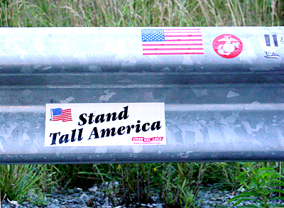 Visitors placed bumper stickers and wrote messages for the victims of Flight 93 on the guardrail of the road next to the crash site.