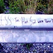 Bless this holy spot where people died written on guard rail.