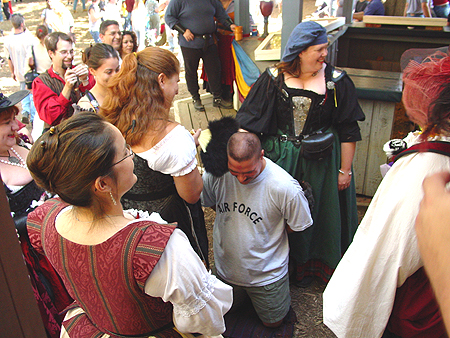 This man is preparing to get kissy tortured by the wenches