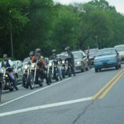 Another group of riders just entering the city.