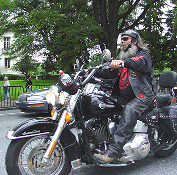 He has a Tea cup helmet so that he can feel the wind through his beard.
