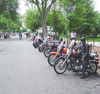 A group a cyclists getting ready to leave.