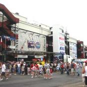 Outside the track, crowds filter in and out of the Indy Sponsor's tents