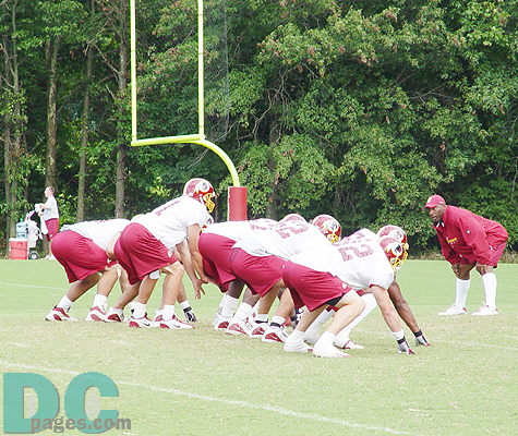 The offensive line takes the field and prepares to fun its first play.