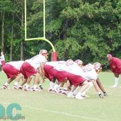The offensive line takes the field and prepares to fun its first play.