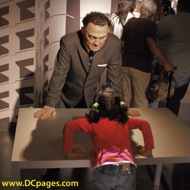 FBI Director, J.Edgar Hoover, interrogates a youth to see if she may be a communist sympathizer.