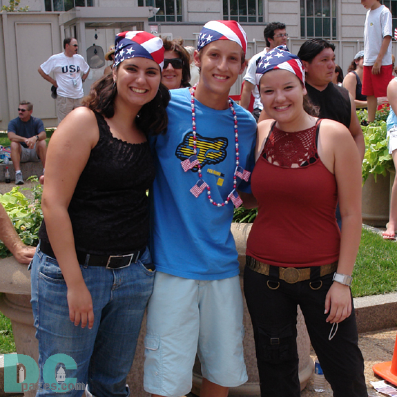 Three patriotic teens watching the parade.