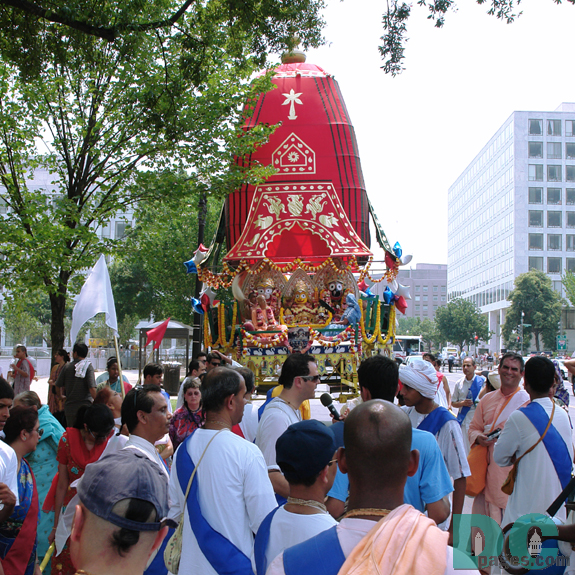 Dancing the Hare Krishna mantra around moving temple. "Hare Krishna Hare Krishna, Krishna Krishna Hare Hare, Hare Rama Hare Rama, Rama Rama Hare Hare." 
