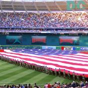 Washington Nationals' Inaugural Home Opener - Members of the District National Guard unfurl a huge Flag for the National Anthem.
