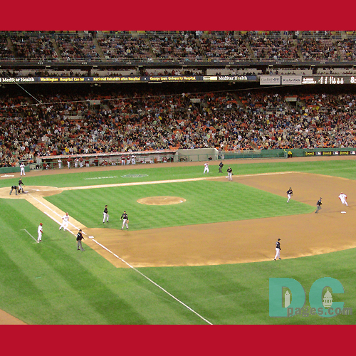 The visiting Florida Marlins take the field after a 5-fun third inning that cost starting pitcher Livan Hernandez a loss.