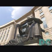 One of the two bronze statues that make up the Oscar S. Straus Memorial Fountain in tribute to the diplomat and Secretary of Commerce and Labor.