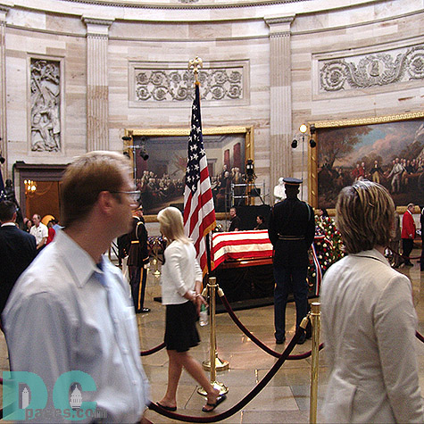 A man watches as he makes his way to the front of the line.