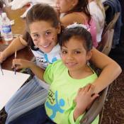 Young Art winners from (Carmen) Georgia and Peru work together on Elaine Thomas  Angel of Nations project, September 9, 2003.