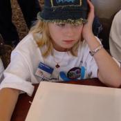 ICAF young artist and her blank canvas panel for the George Rodrigue Art for Peace Pyramid, September 11, 2003