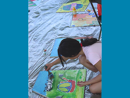 Young Artist works on her Art for Peace Pyramid panel
