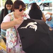 Peace parasols painting in Public Assemblys arts and crafts activity, September 11, 2003